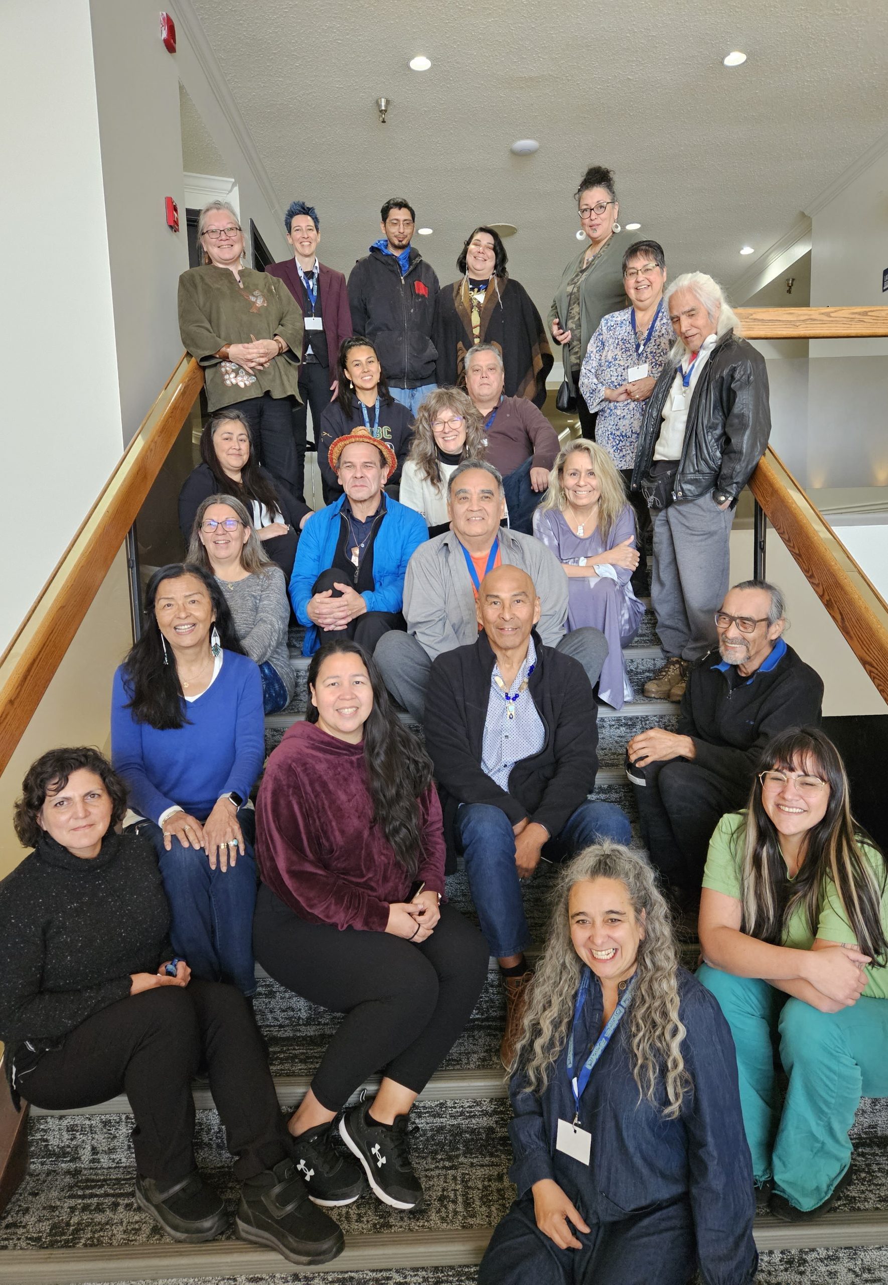 Gathering of Event Facilitators and Participants Facilitators and participants gathering together for a photo on the stairs.